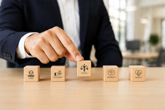 Code of conduct in business concept. Wooden blocks with code of conduct icons%3B code  integrity  honesty  respect  and ethics  the foundation of a strong corporate code of conduct. Corporate ethics.