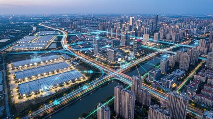 Fototapeta premium Aerial view of a modern city at dusk with illuminated network lines connecting buildings and warehouses