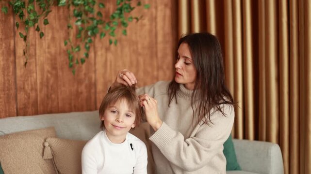 Mother, checking her sons hair for lice, precautions child hair
