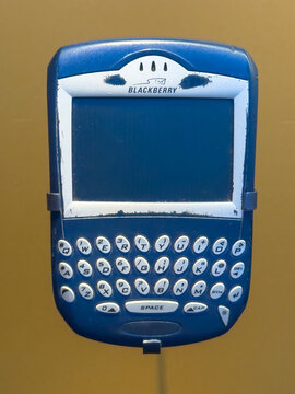 Ottawa, Ontario, Canada. August 25, 2026. Front close-up view of a vintage blue BlackBerry 6210 mobile smartphone on museum display.