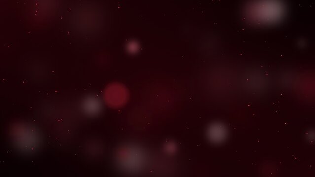 Dark red bokeh background with tiny light particles