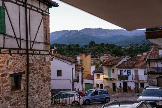 Traditional Spanish Mountain Village with Old Houses and Scenic Peaks at Evening Twilight