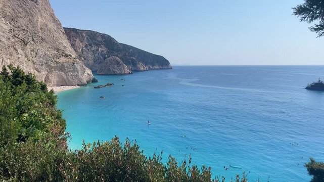 Panoramic view of Porto Katsiki beach on Lefkada island Greece with turquoise Ionian sea waters white cliffs and people swimming stock video. High quality 4k footage