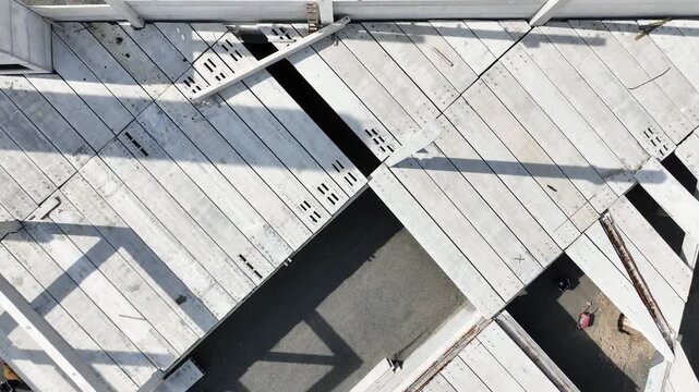 Modern Prefabricated Concrete Building Under Construction with Precast Columns Wall Panels and Hollow Core Floor Slabs, Aerial View