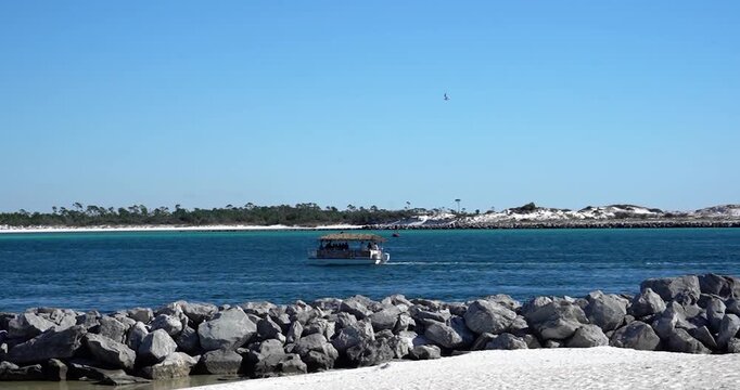 Tourist pontoon boat in St. Andrews Bay in Panama City Beach, Florida