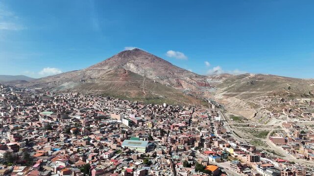 pic aerial video of the legendary Cerro Rico mountain towering over the historic mining city of Potosi in the Bolivian Andes.