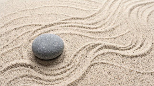 A single smooth grey stone resting on raked sand with gentle flowing patterns, creating a peaceful and minimalist zen garden atmosphere for meditation and relaxation