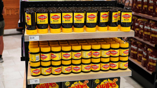 Vegemite shelf display showcasing popular Australian products in a vibrant retail setting