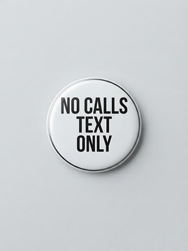 A round white button pin with the black text no calls text only isolated on white background