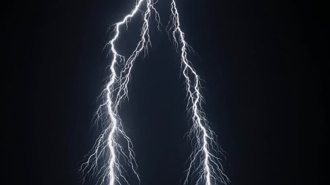 Lightning strikes illuminate dark sky with multiple branches, showcasing the dynamic energy and intensity of a thunderstorm in a dramatic natural display