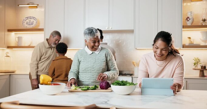 Family, cooking and high five with tablet in kitchen for winning, teamwork or meal prep together. Mom, grandma or smile with technology or ingredients for success, organic cuisine or bonding in home