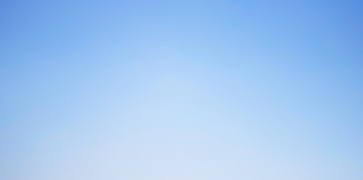 Seamless azure to pale white sky gradient background featuring a smooth, cloudless transition and soft atmospheric light, ideal for clean minimalist design projects and versatile digital backdrops.