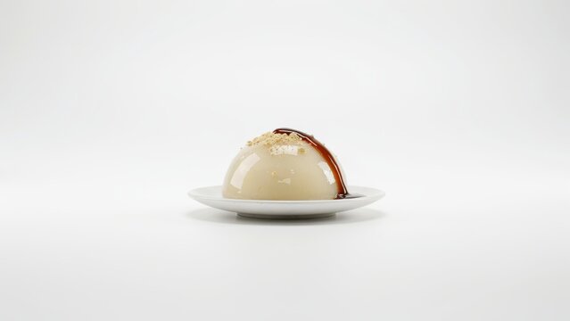 Raindrop cake with brown sugar syrup and soybean powder isolated on white background. Perfect for menu design or dessert advertising.