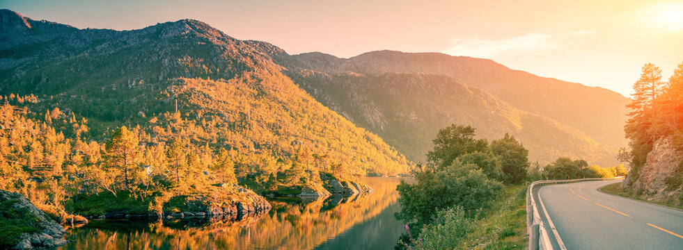 Highway along the mountain river at sunset. Norway