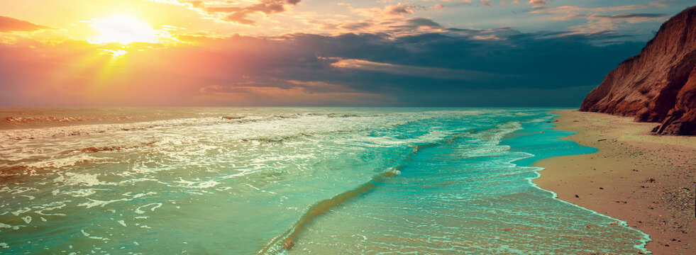 Seascape with clay steep coast. Seashore on a cloudy day