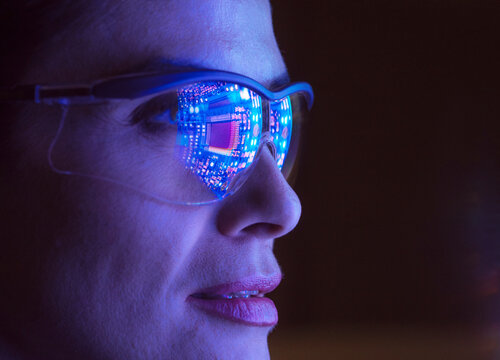 Woman engineer designs artificial intelligence technology indoors