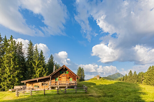 Germany, Bavaria, Bad Wiessee, Clouds over alpine hut in summer