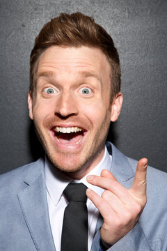 Portrait of businessman gesturing, close up