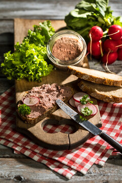 Liverwurst spread on slice of brown bread