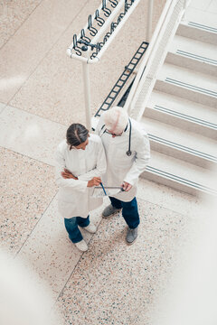 Doctors discussing AI in medicine and teamwork at hospital indoors