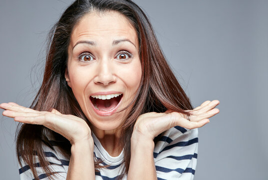 Portrait of surprised woman screaming out loud