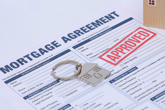 Approved mortgage application agreement form brings joyful relief during successful financial contract review process