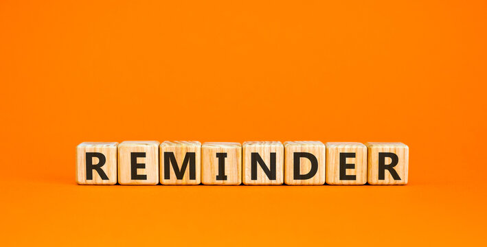 Reminder word symbol. Concept word Reminder on beautiful wooden blocks. Beautiful orange background. Business support help reminder word concept. Copy space.