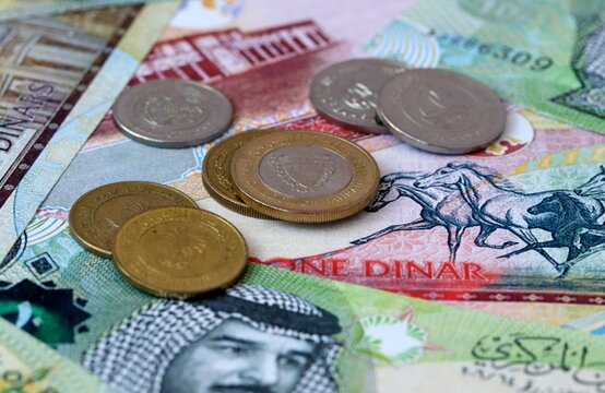 Bahraini dinar money banknotes and coins on table. Bahrain cash bills of BHD currency