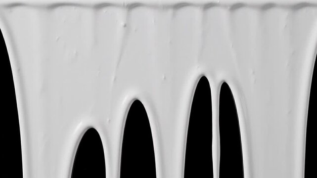 White paint dripping down on black background
