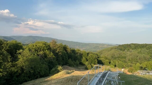 .Mountain coaster attraction with an electrically powered rail and cable system in the Domnești area near Pitești, Romania.