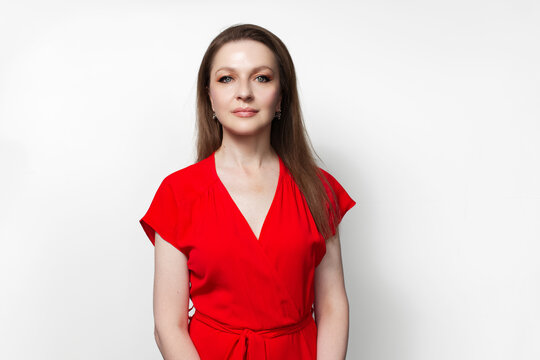 Young girl in red dress isolated on white background.