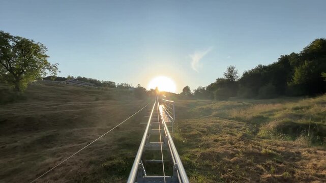 .Mountain coaster attraction with an electrically powered rail and cable system in the Domnești area near Pitești, Romania.