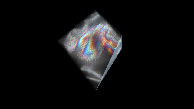 Crystal prism floats with chromatic dispersion and iridescent light patterns in a futuristic 3D animation for dark mode UI assets and gaming overlays
