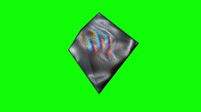 Crystal prism spins against an isolated chroma key backdrop in a 3D animation featuring rainbow refraction designed for gaming VFX and app UI compositing