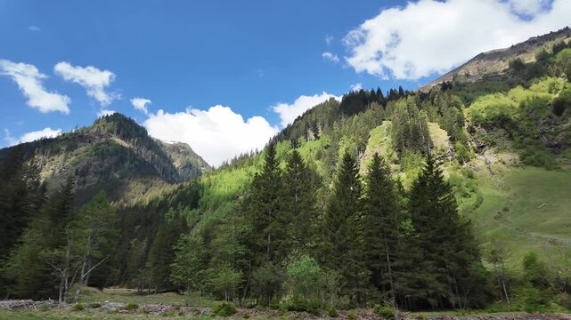 Mountain landscape valley. Mountainous landscape with cloudy sky. Scenic green hill. Alpine scenery. Panorama mountain landscape. Nature scenery and mountain landscape. Travel and outdoor exploration