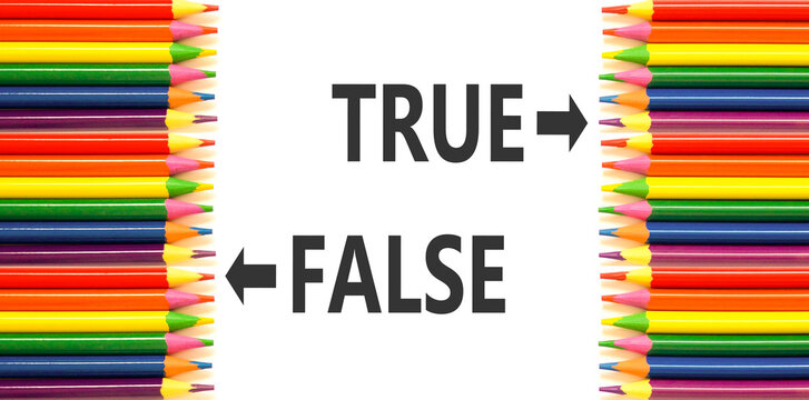 True or false symbol. Concept word True or False on beautiful white paper. Beautiful white background. Colored pencils. Business and true or false concept. Copy space.