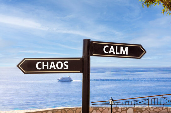 Calm instead chaos words symbol. Concept words Calm Chaos on beautiful black road sign. Beautiful blue sky background. Business medical psychology calm chaos concept. Copy space.