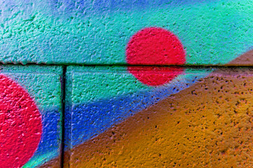 Beautiful colorful street art graffiti background. Abstract painting pattern of urban art on a grunge wall © Yaroslav