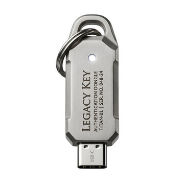 Legacy Key hardware authentication dongle, industrial metal USB-C security token on white background, cyber security access device