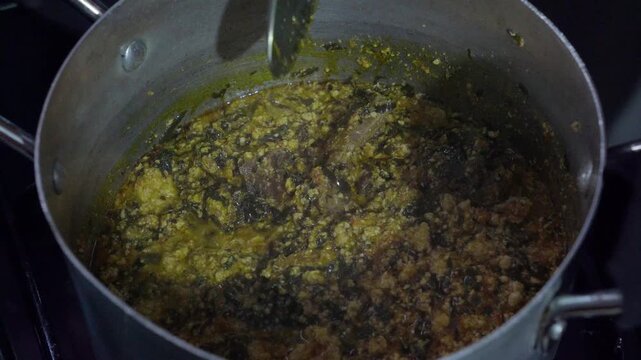 Cooking of African Yoruba vegetable soup