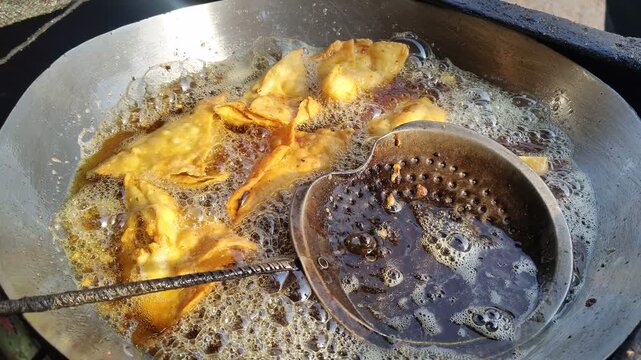 Deep Frying Crispy Samosas in Large Kadai