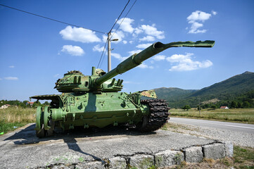 Naklejka premium Destroyed tank during the war. Yugoslav M84 tank destroyed by anti-armor weapons.