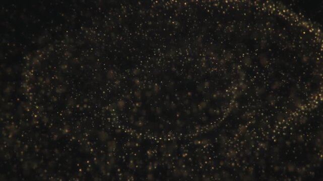 Seamless video loop of elegant floating gold dust and glowing particles on a deep black background, premium awards ceremony concept, 4K