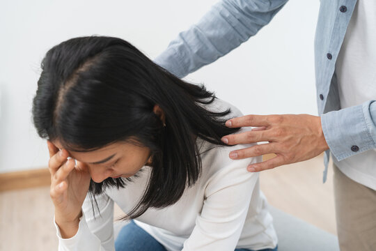 Counselor touching friend shoulder and encouraging to help relieve her sad