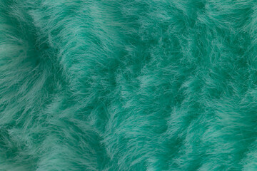 Obraz premium Macro close up of turquoise green faux fur texture background