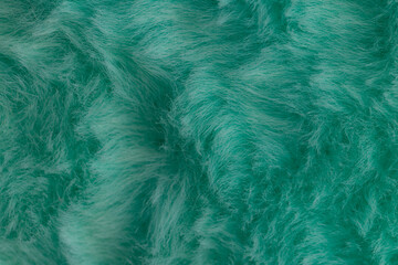 Obraz premium Macro close up of turquoise green faux fur texture background