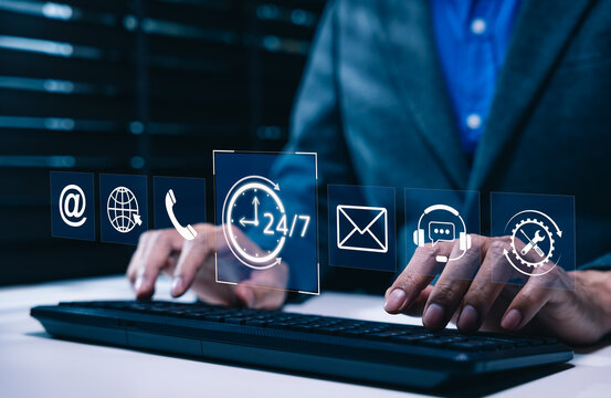 Customer support and 24/7 service concept. professional using computer keyboard, surrounded by icons for email, phone, global communication, help desk, technical assistance, continuous online support