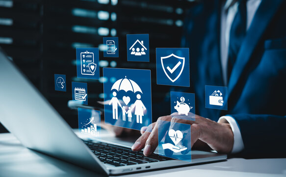 Family life insurance and health protection concept. Businessman using laptop with digital icons of medical care coverage, home safety security, financial wealth planning, retirement risk management