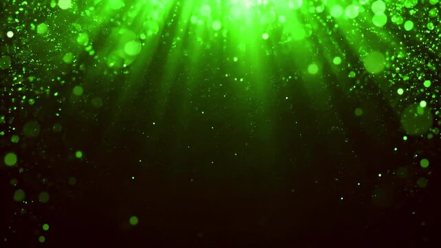 Seamless emerald bokeh lights and green rays over dark copy space