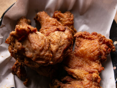 Crispy Fried Chicken Pieces on Rustic Plate with Burlap Cloth, Comfort Food